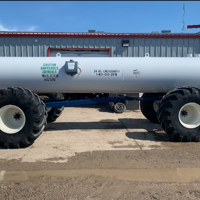 Tank filled with ammonia on a trailer with 4 large wheels
