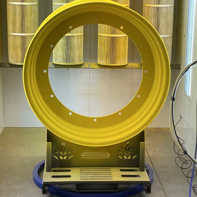 Large round yellow metal object