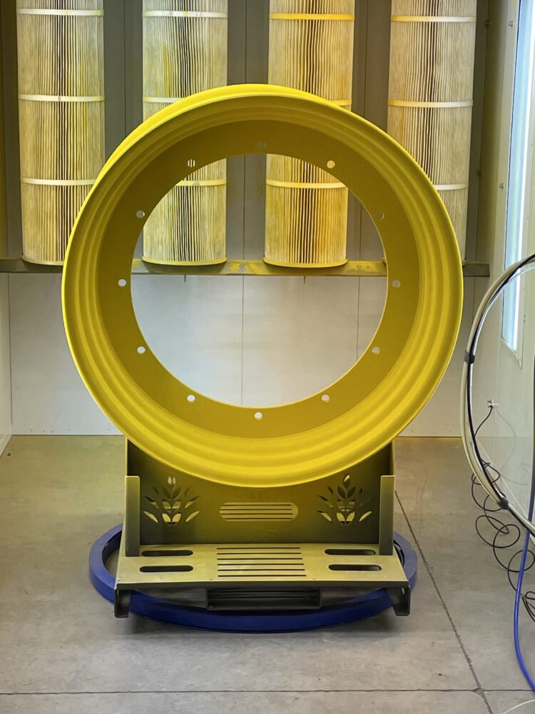Large round yellow metal object